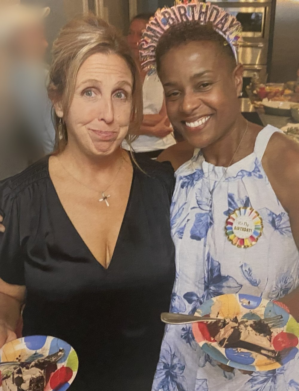 Mondel and Luigina smiling together at a birthday celebration